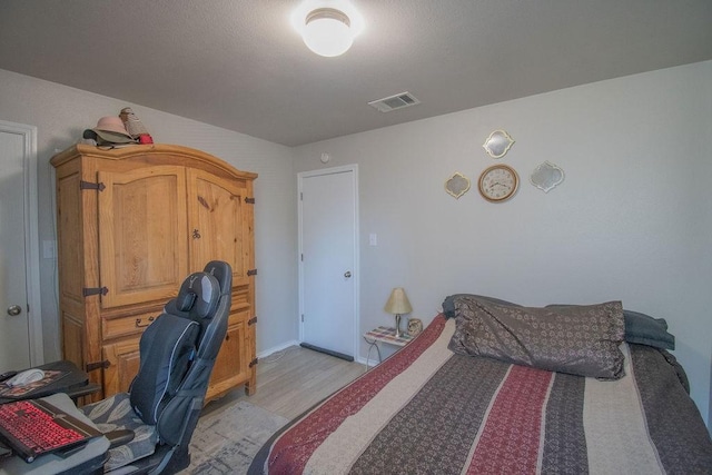 bedroom with light hardwood / wood-style floors