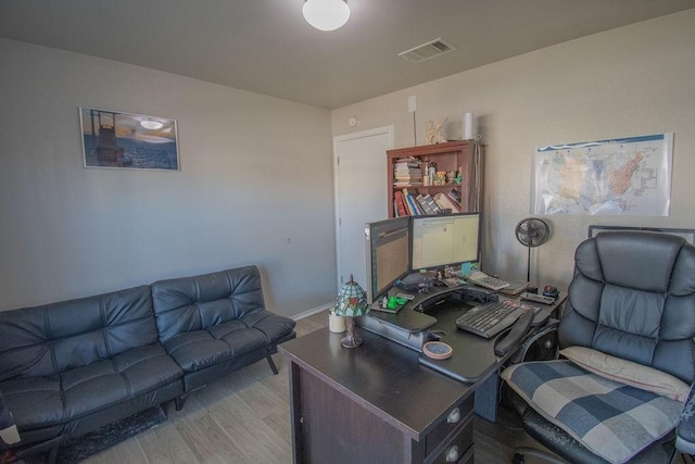 office with light hardwood / wood-style floors