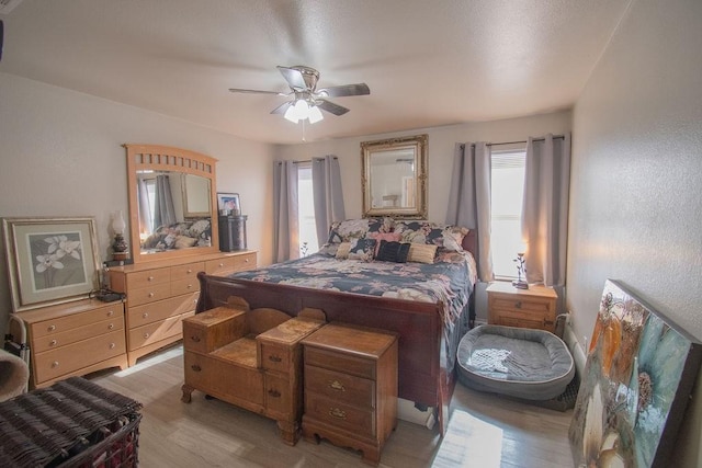 bedroom featuring ceiling fan and light wood-type flooring