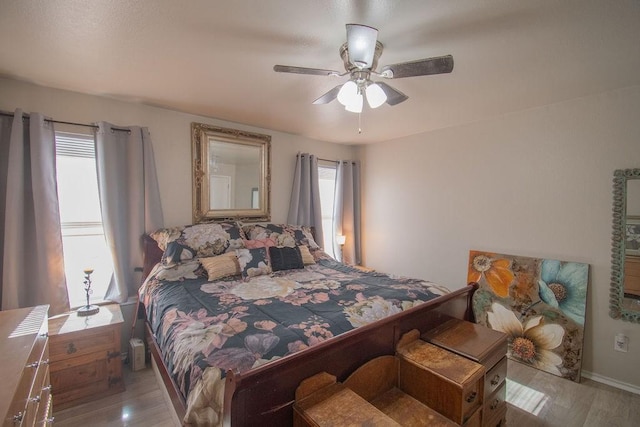 bedroom featuring ceiling fan and light wood-type flooring