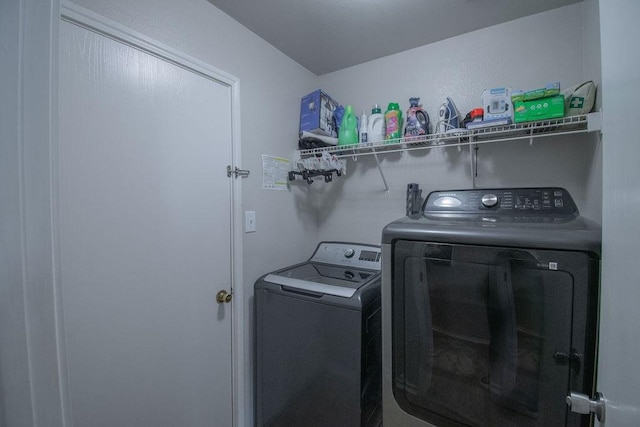 laundry room with washer and clothes dryer