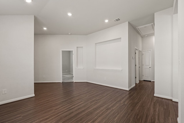 spare room featuring dark hardwood / wood-style floors