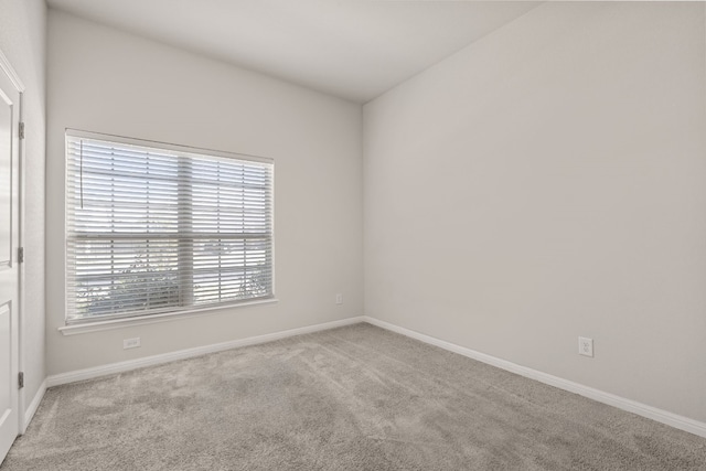 empty room featuring light colored carpet