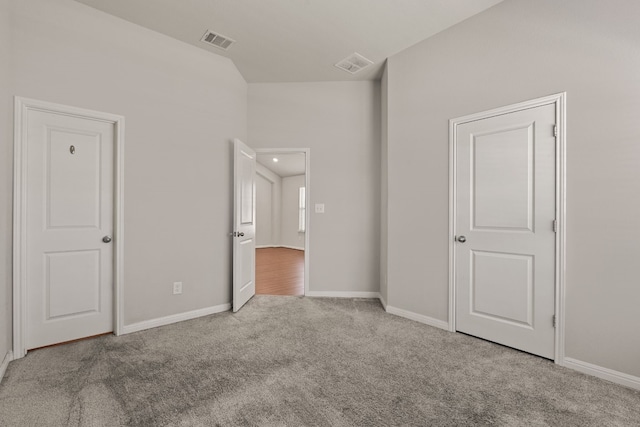 unfurnished bedroom with light carpet