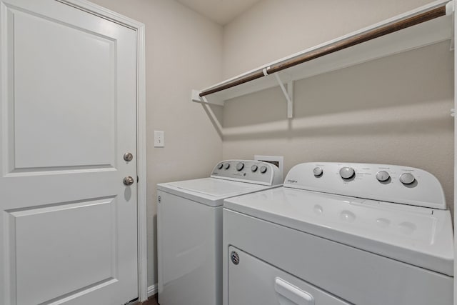 laundry area featuring washing machine and clothes dryer