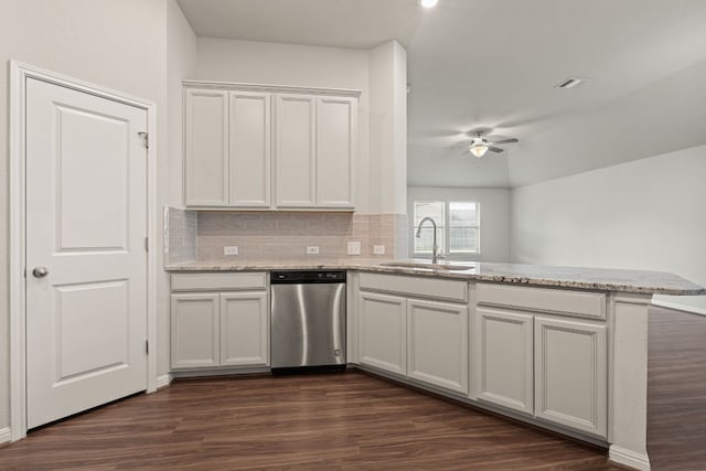 kitchen featuring white cabinetry, dishwasher, sink, kitchen peninsula, and dark wood-type flooring