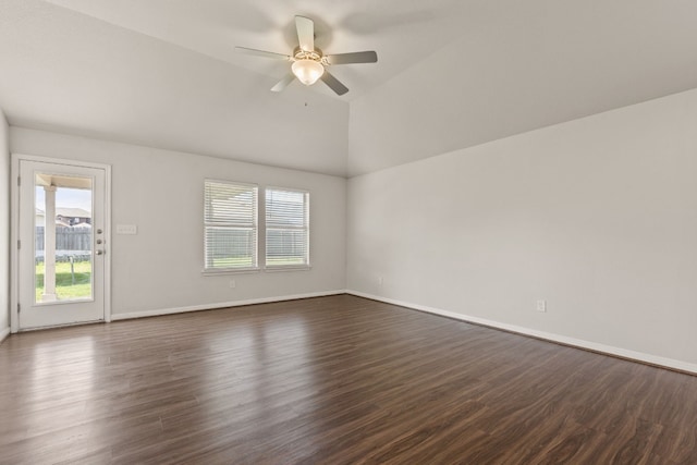 empty room with dark wood-type flooring, ceiling fan, and lofted ceiling