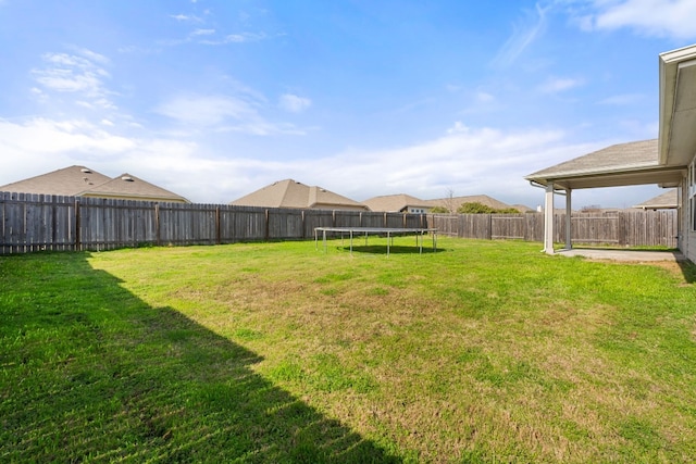 view of yard with a trampoline