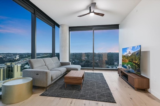 interior space with ceiling fan