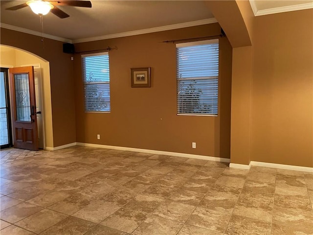 spare room featuring crown molding and ceiling fan