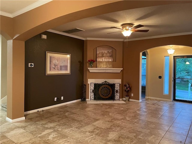 unfurnished living room featuring ornamental molding and ceiling fan