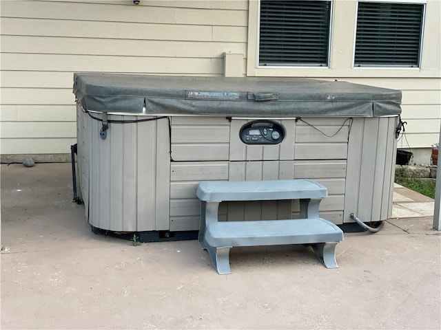 exterior details featuring a jacuzzi