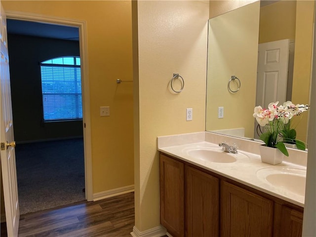 bathroom with vanity and hardwood / wood-style floors