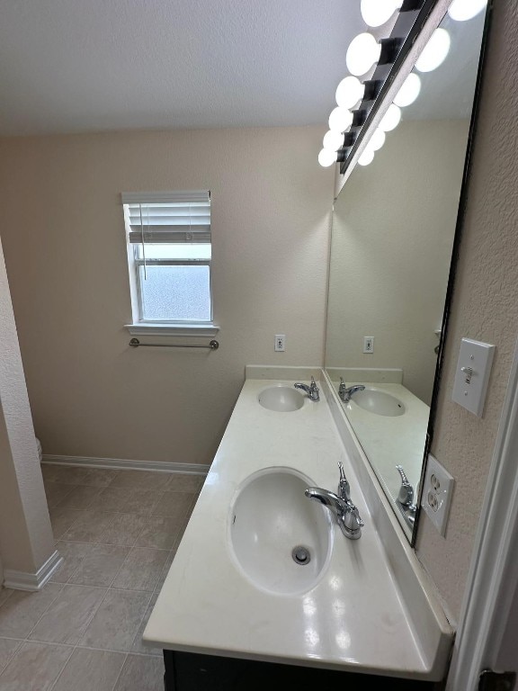 bathroom featuring tile patterned floors and vanity