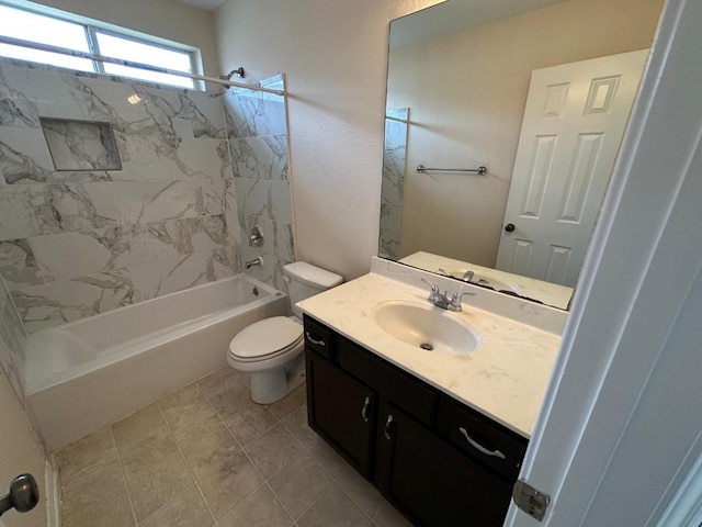 full bathroom with vanity, tiled shower / bath combo, and toilet