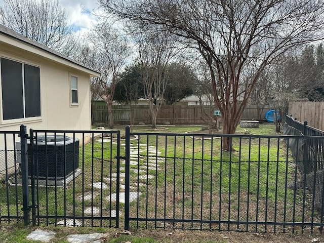 view of yard featuring central AC