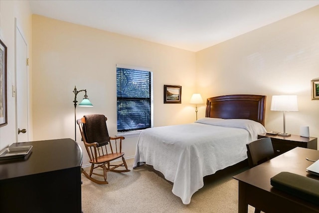 bedroom with light colored carpet