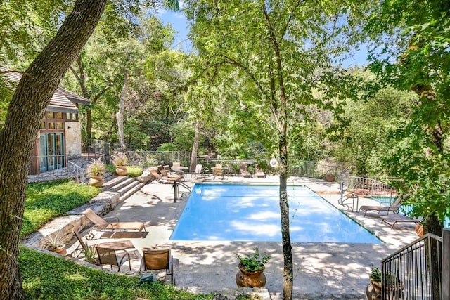 view of swimming pool with a patio area