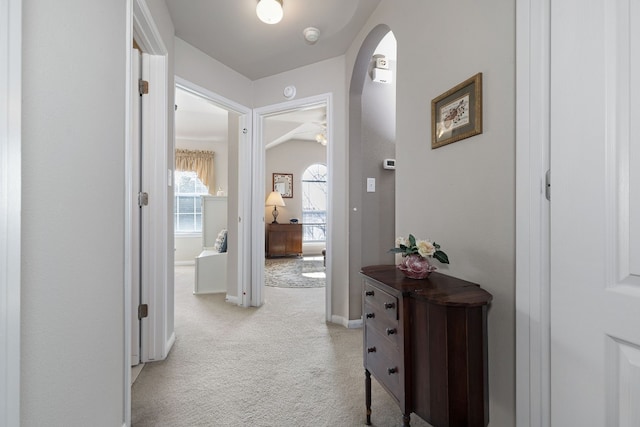 hallway with light colored carpet