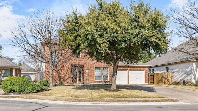 view of front of house with a garage and a front lawn