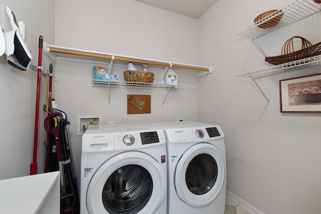 laundry area with washing machine and clothes dryer