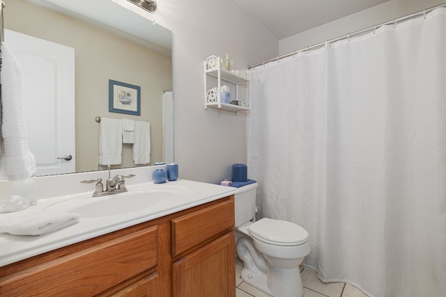 bathroom with vanity, tile patterned floors, and toilet