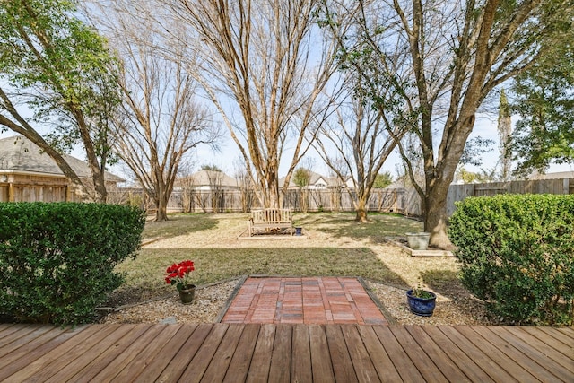 wooden terrace with a yard