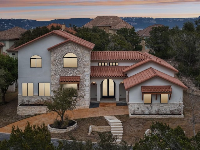 view of front of property with a mountain view