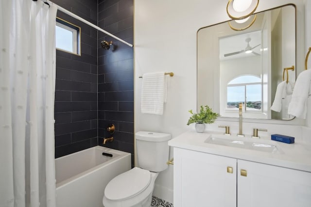 full bathroom featuring vanity, a wealth of natural light, shower / tub combo, and toilet