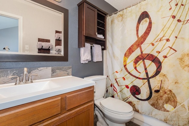 bathroom with vanity, toilet, and a shower with shower curtain