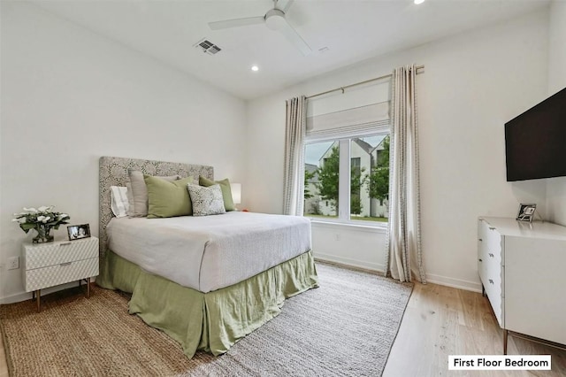 bedroom with ceiling fan and light hardwood / wood-style flooring