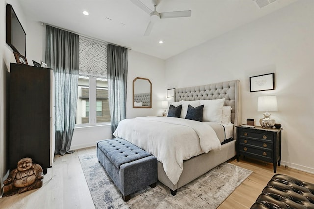 bedroom featuring ceiling fan and light hardwood / wood-style floors