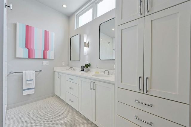 bathroom with tile patterned flooring, vanity, and a shower with shower door