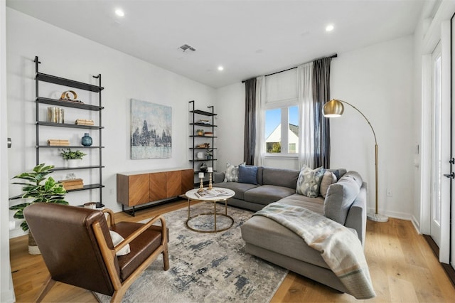 living room with light hardwood / wood-style flooring