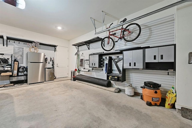 garage featuring stainless steel refrigerator