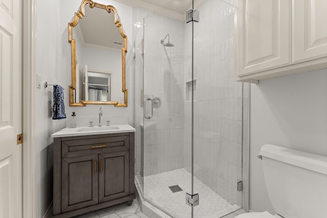 bathroom with ornamental molding, vanity, walk in shower, and toilet