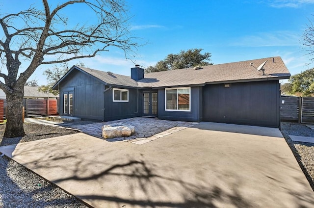 back of property with a patio and french doors