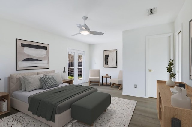 bedroom with hardwood / wood-style flooring, access to outside, french doors, and ceiling fan