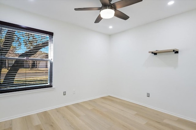 unfurnished room with hardwood / wood-style floors and ceiling fan