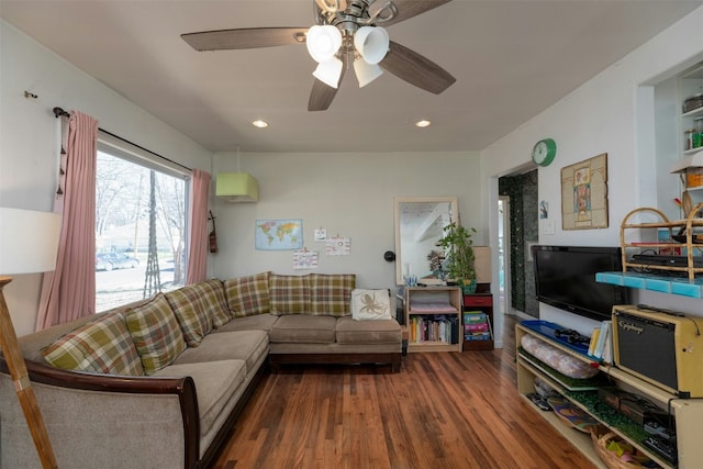 living room with hardwood / wood-style flooring and ceiling fan