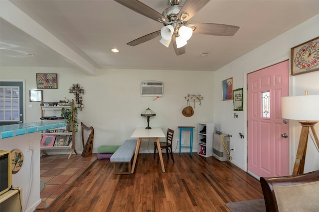 foyer entrance with beam ceiling, ceiling fan, dark hardwood / wood-style floors, and a wall unit AC