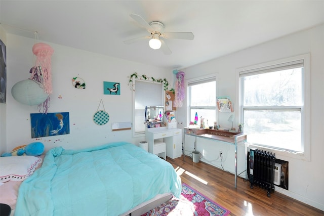 bedroom with hardwood / wood-style floors and ceiling fan