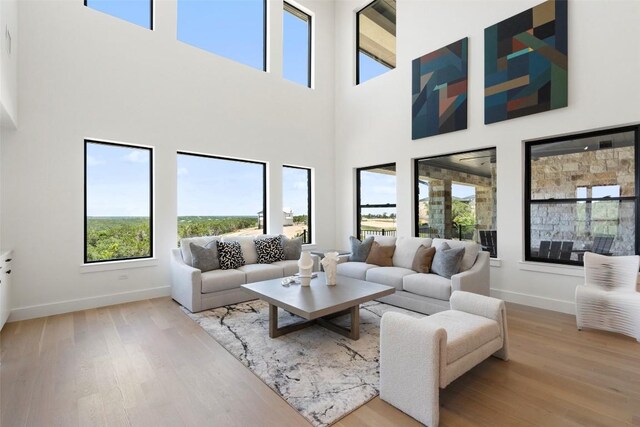 6101 Adhara Pass, Austin, TX 78730 - living room featuring wood finished floors and a towering ceiling