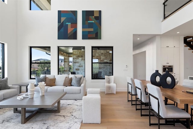 6101 Adhara Pass, Austin, TX 78730 - living area with a towering ceiling and light wood-type flooring