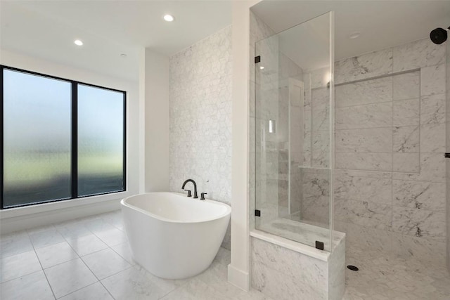 6101 Adhara Pass, Austin, TX 78730 - full bathroom featuring a stall shower, a freestanding bath, recessed lighting, and tile patterned flooring