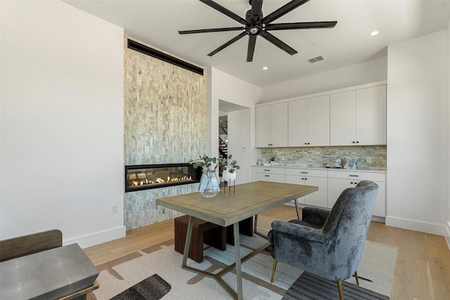 6101 Adhara Pass, Austin, TX 78730 - office area with ceiling fan, light wood-style floors, a fireplace, and recessed lighting