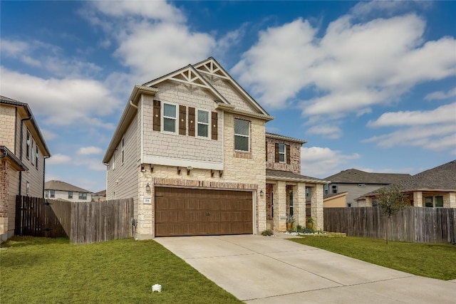 craftsman-style house featuring a garage and a front lawn