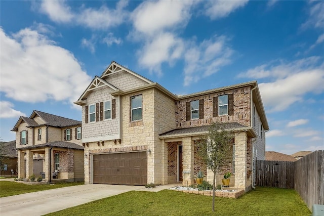 craftsman house with a garage and a front lawn