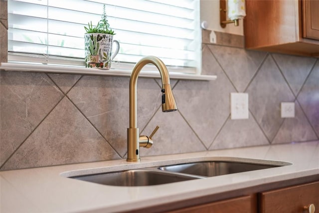 kitchen featuring sink and decorative backsplash