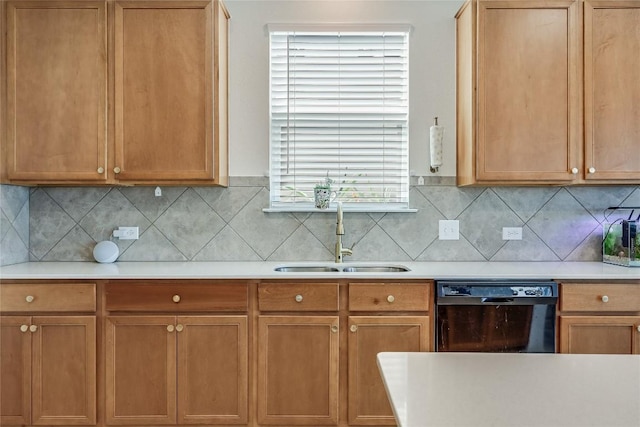 kitchen with tasteful backsplash, black dishwasher, and sink